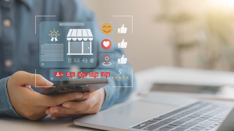 Man at a laptop with image of local seo overlayed